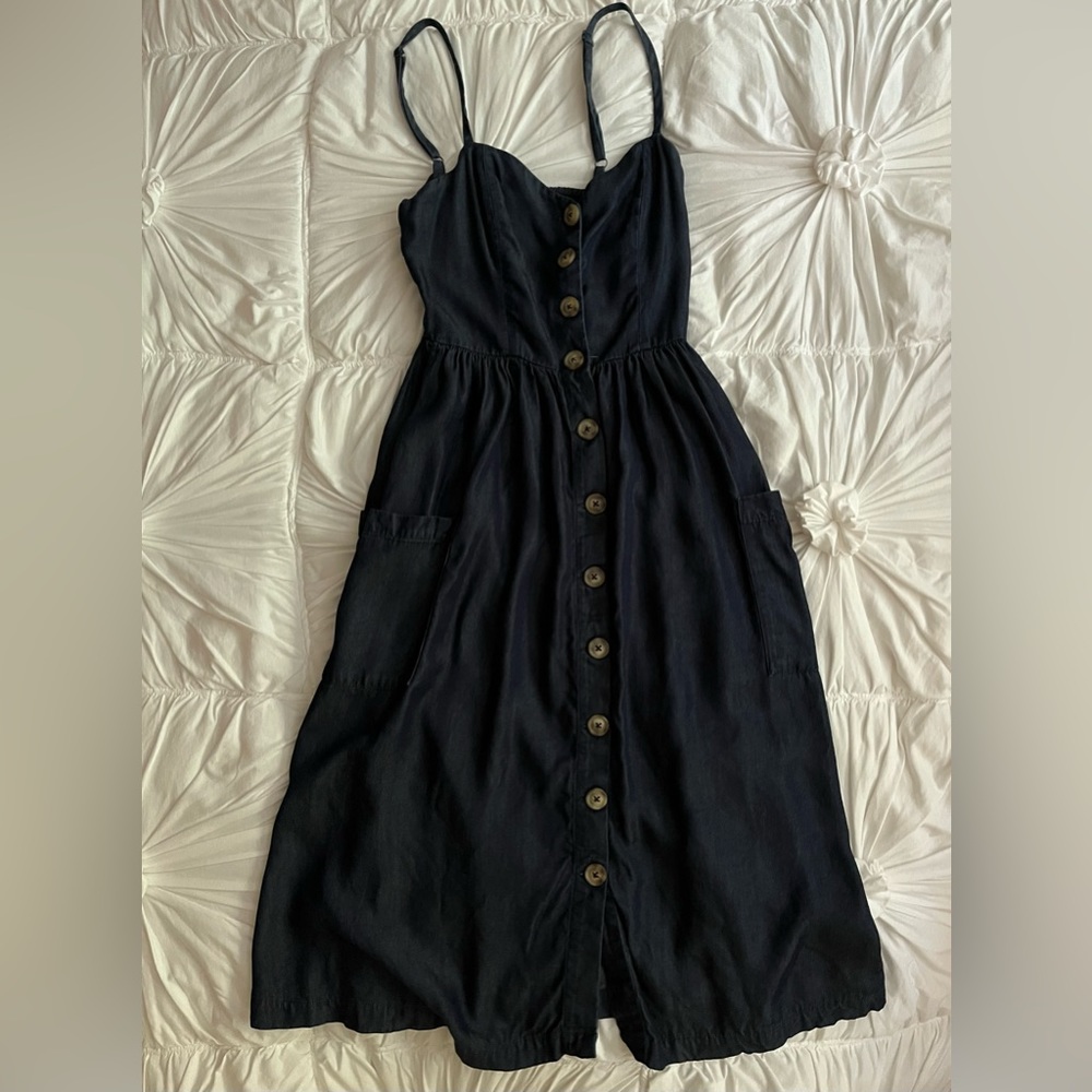 Dress from urban outfitters, dark denim color with pockets.